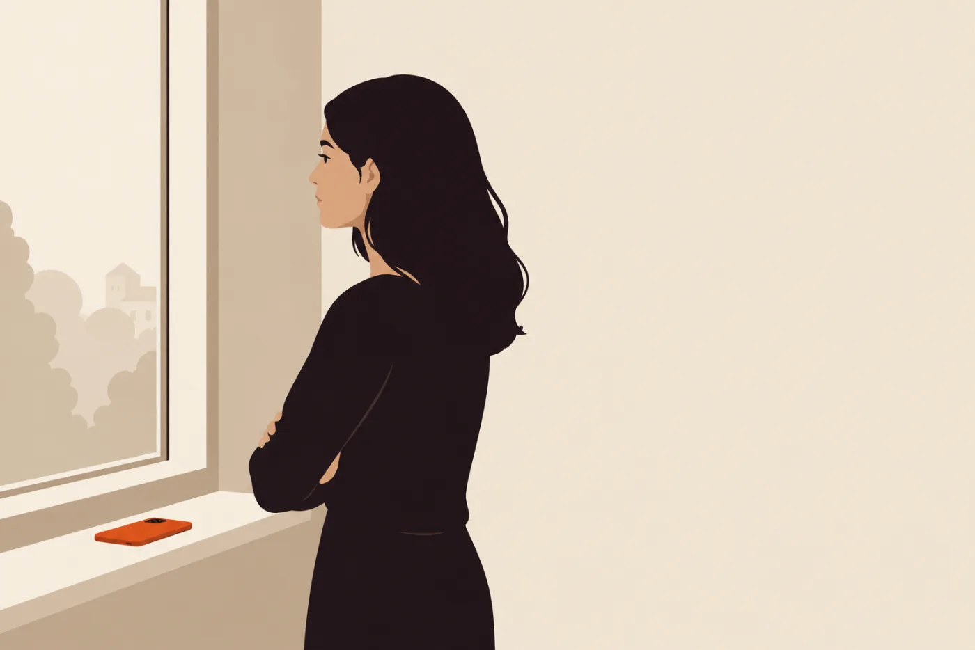 Woman standing at a window with her arms folded, her phone lying face down on the sill beside her